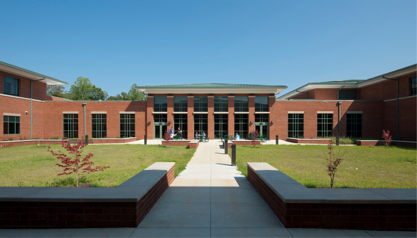 Located in Orange County, Locust Grove Middle School is a brick building situated in a serene grassy area.