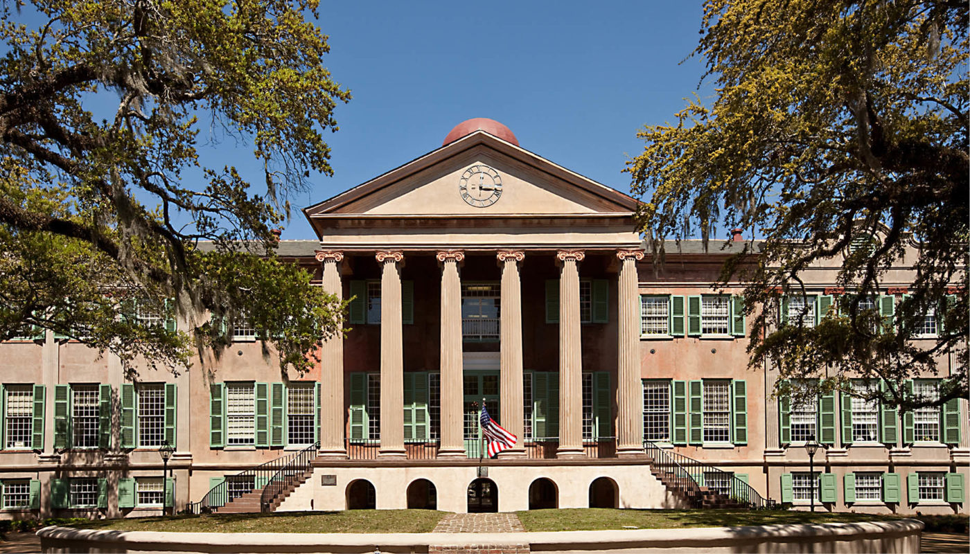 Randolph Hall, a large building with columns and a fountain, is a stunning example of the College of Charleston's architectural beauty.