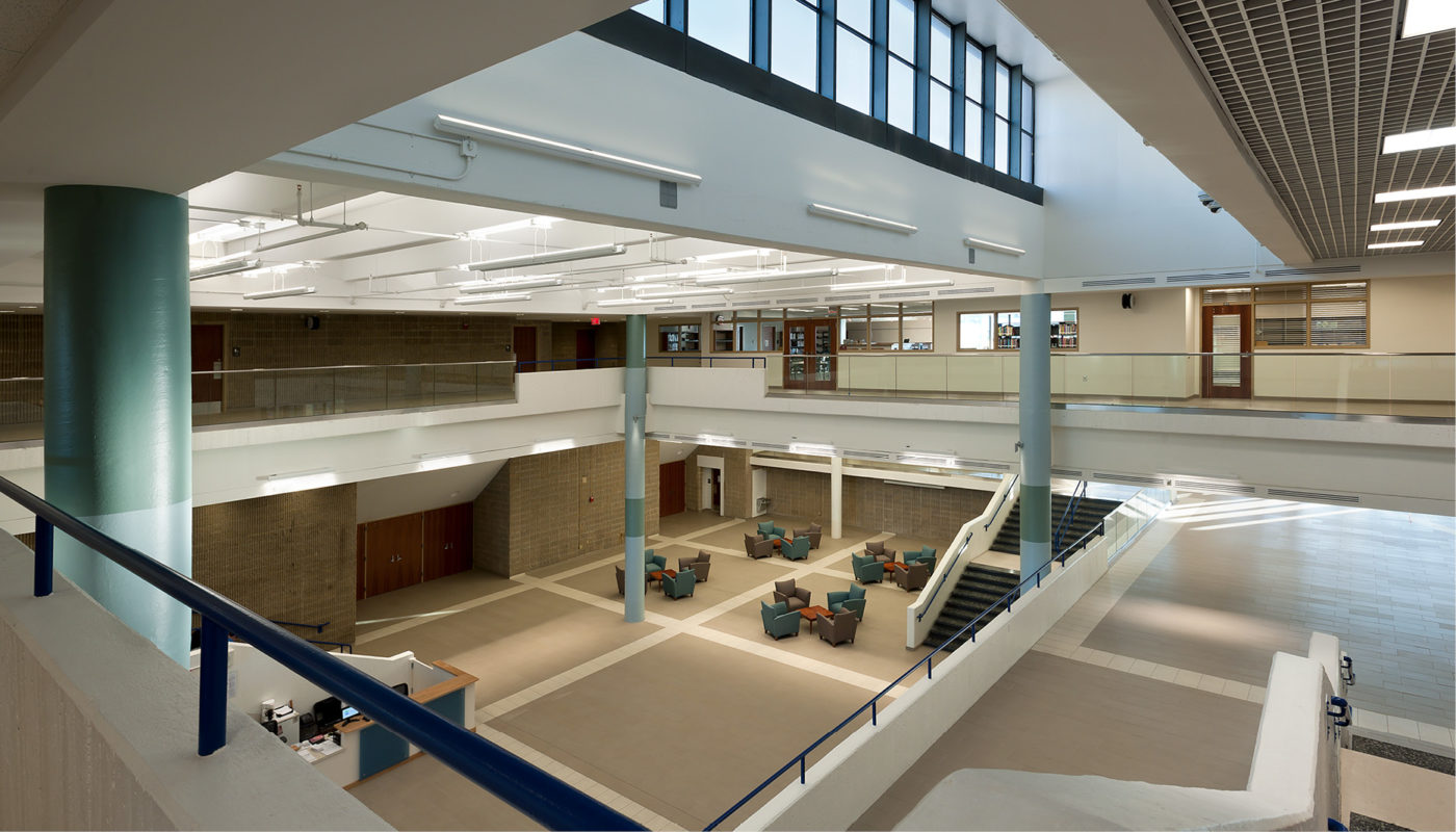 The SEED School of Maryland, a building with a large atrium and stairs, provides educational opportunities for students through the SEED Foundation.