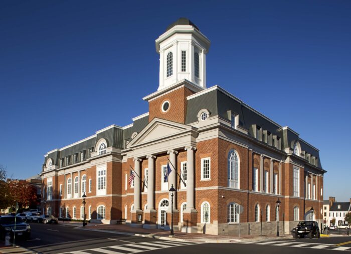 The historic courthouse in Fredericksburg is a magnificent landmark, characterized by its impressive red brick structure and prominent clock tower.