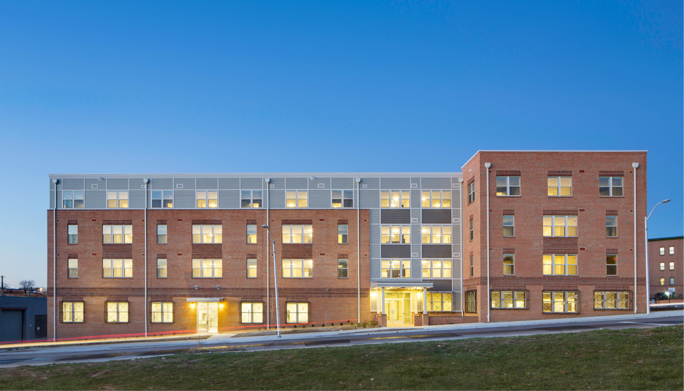 Mary Harvin's Transformation Center, a large brick building, is beautifully lit up at dusk.