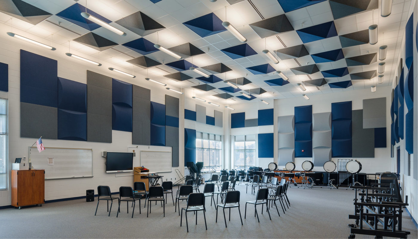 A large room with blue and white acoustic panels, located at Colgan High School in Prince William County Public Schools.