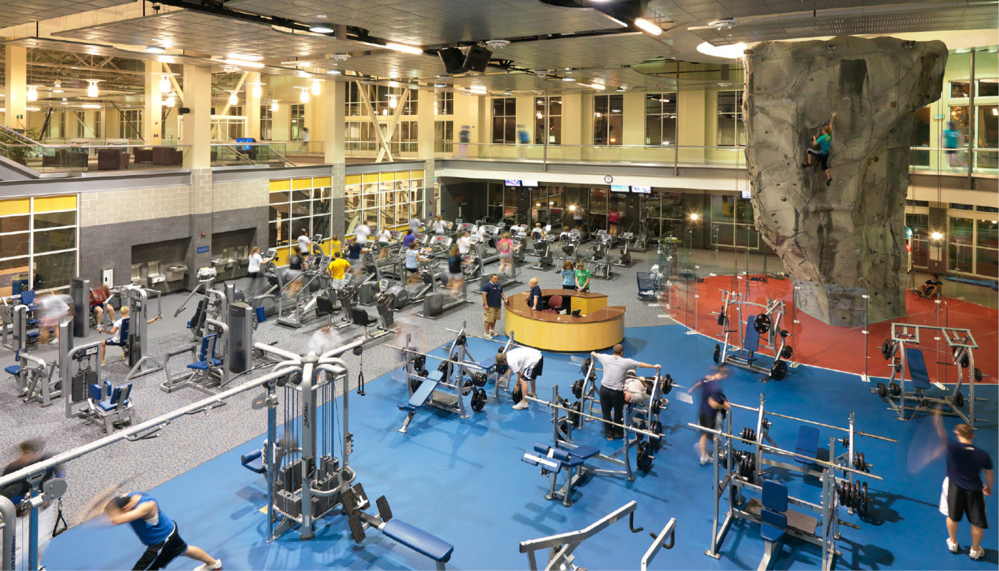 A wellness center at Longwood University, bustling with people focused on health and fitness.