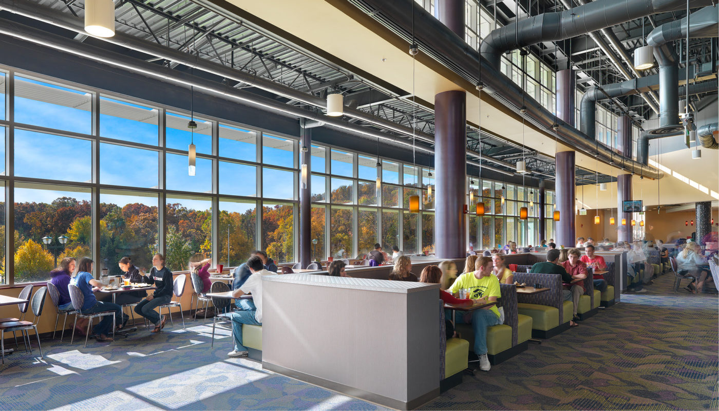 A rendering of a cafeteria with large windows.