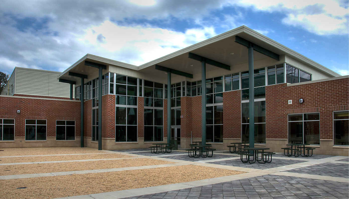 A brick building with large windows, serving as the Northumberland Middle School.