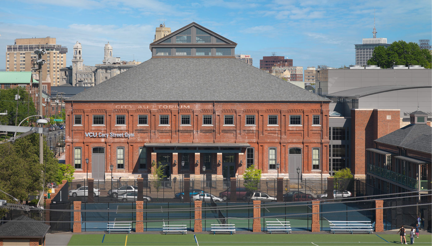 An artist's rendering of a building with a tennis court.