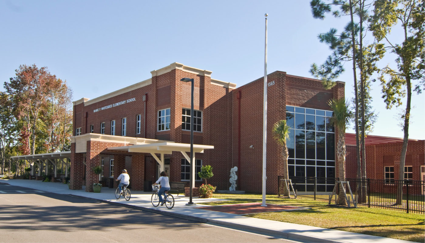 A red brick building located in the Charleston County School District, possibly Whitesides Elementary School.