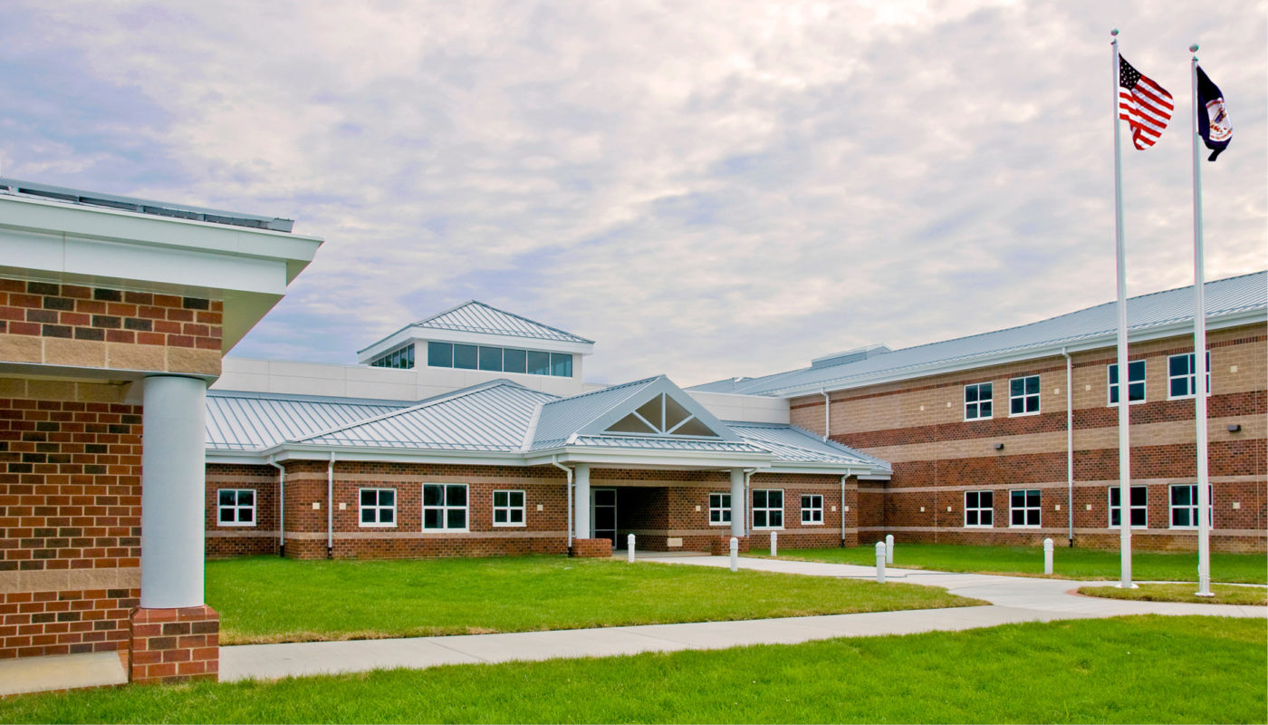 Holman Middle School, a brick building with a flagpole, located in Henrico County Public Schools.