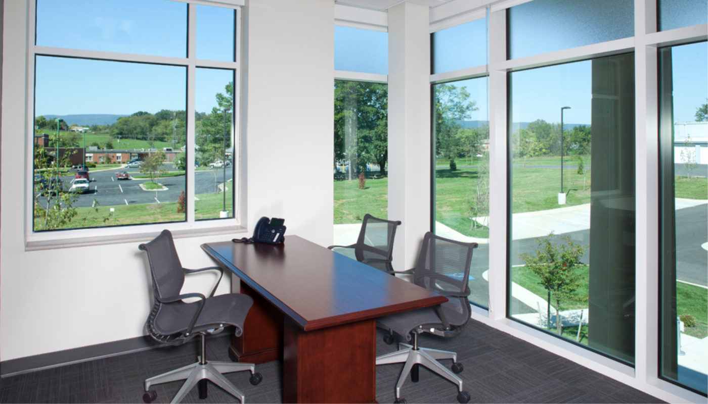 A conference room with large windows.