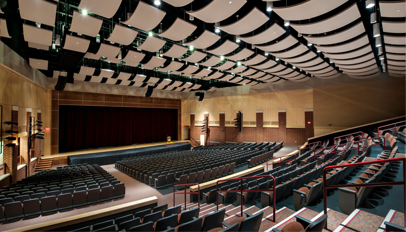 A large auditorium with rows of seats located at Paint Branch High School, a part of Montgomery County Public Schools.