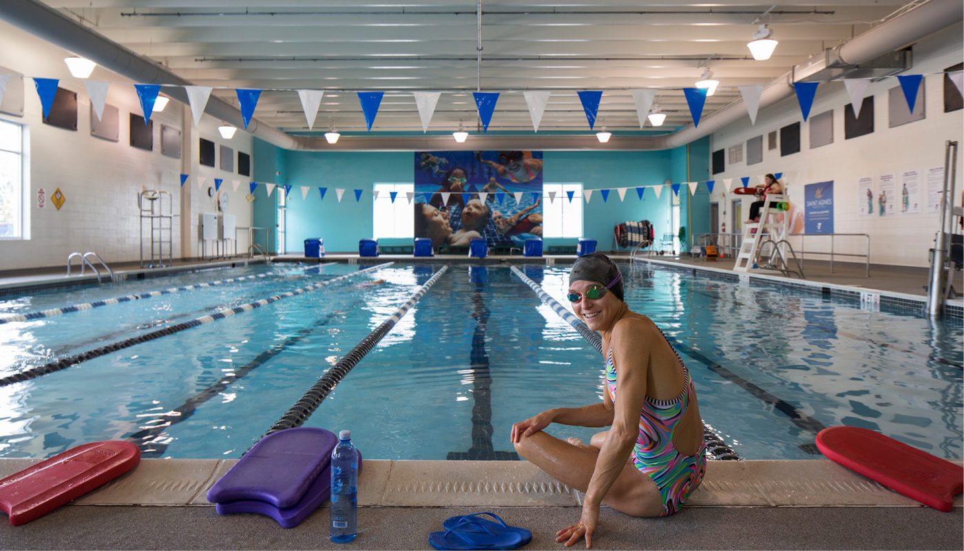 A woman in a swimsuit enjoying the indoor swimming pool at the Catonsville Family Center Y in Maryland.