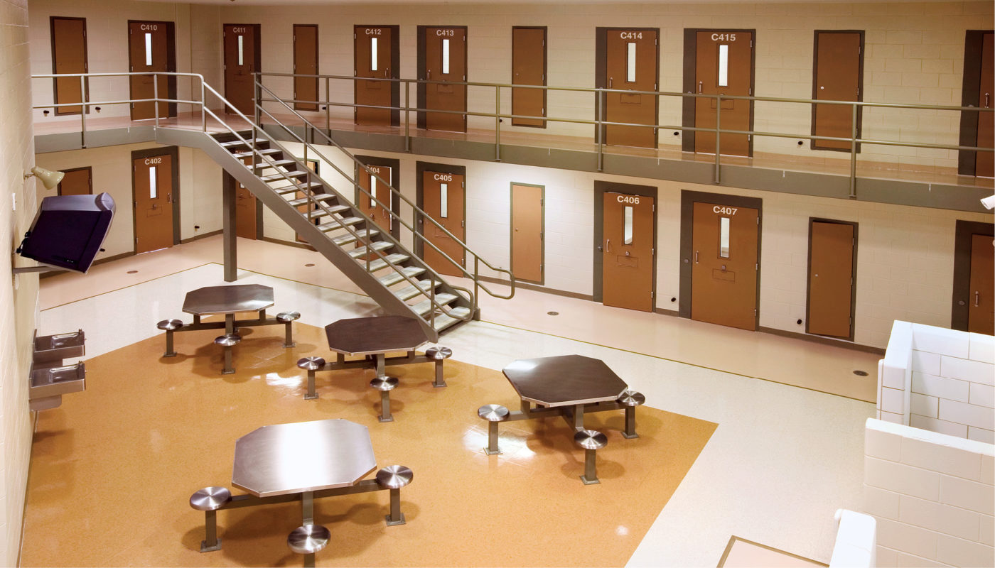 Tables and chairs in a Chesterfield County Detention Center room.