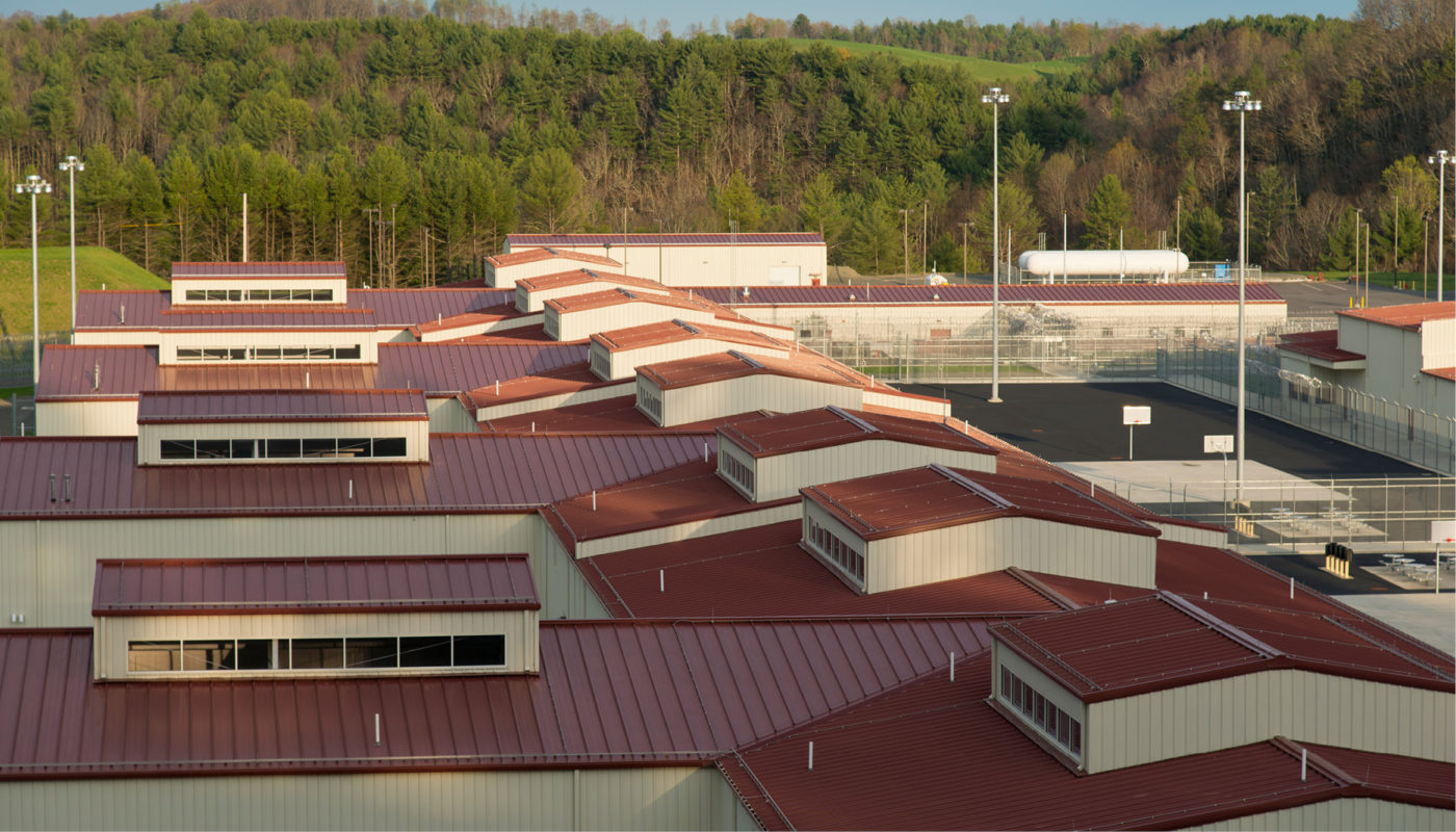 The River North Correctional Institution, a large building with a red roof.