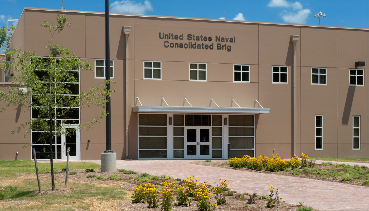 A U.S. Naval building displaying a sign for the Consular City.