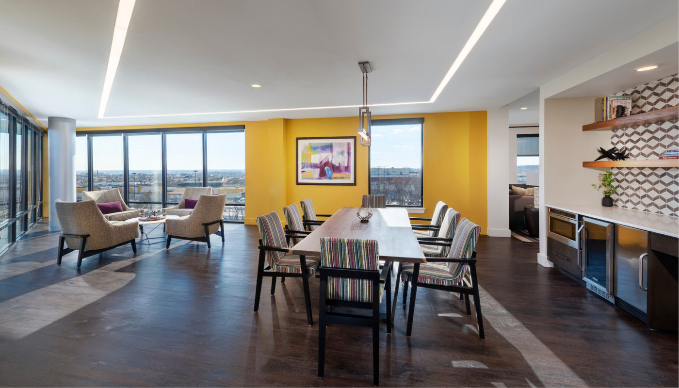 A dining room with a view of the city in Metro Heights.