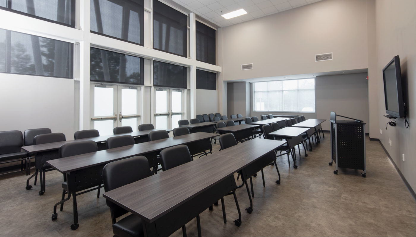 A large conference room at the Law Enforcement Center with tables and chairs.