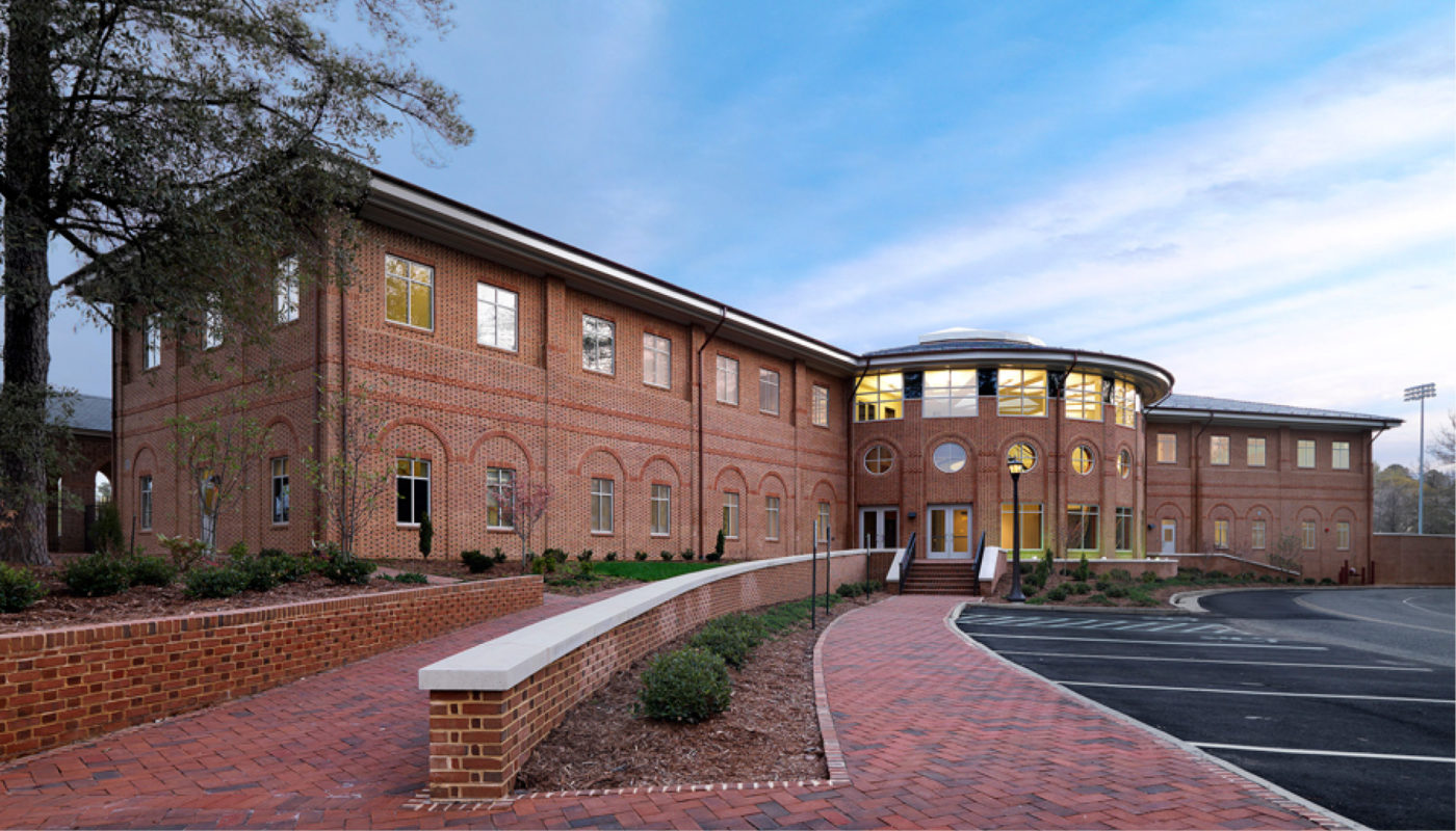 The Jimmye Laycock Athletic Training Facility, located on the campus of the College of William and Mary, stands as a brick building surrounded by a brick walkway.