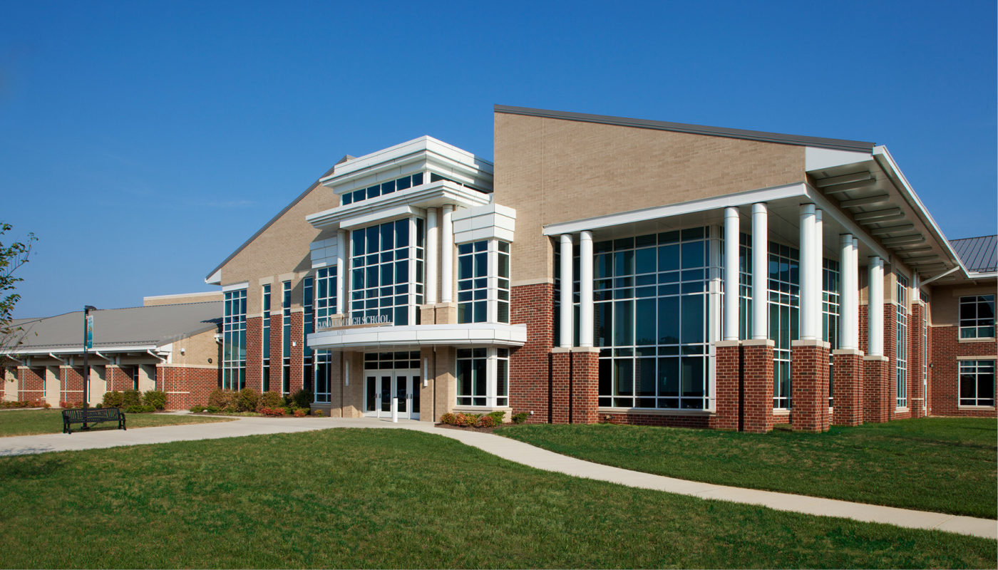 Glen Allen High School, a large building in the middle of a grassy field, is located in Henrico County Public Schools.