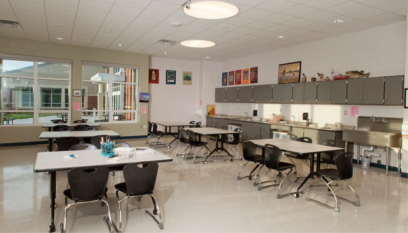 A classroom at Glen Allen High School with tables and chairs.