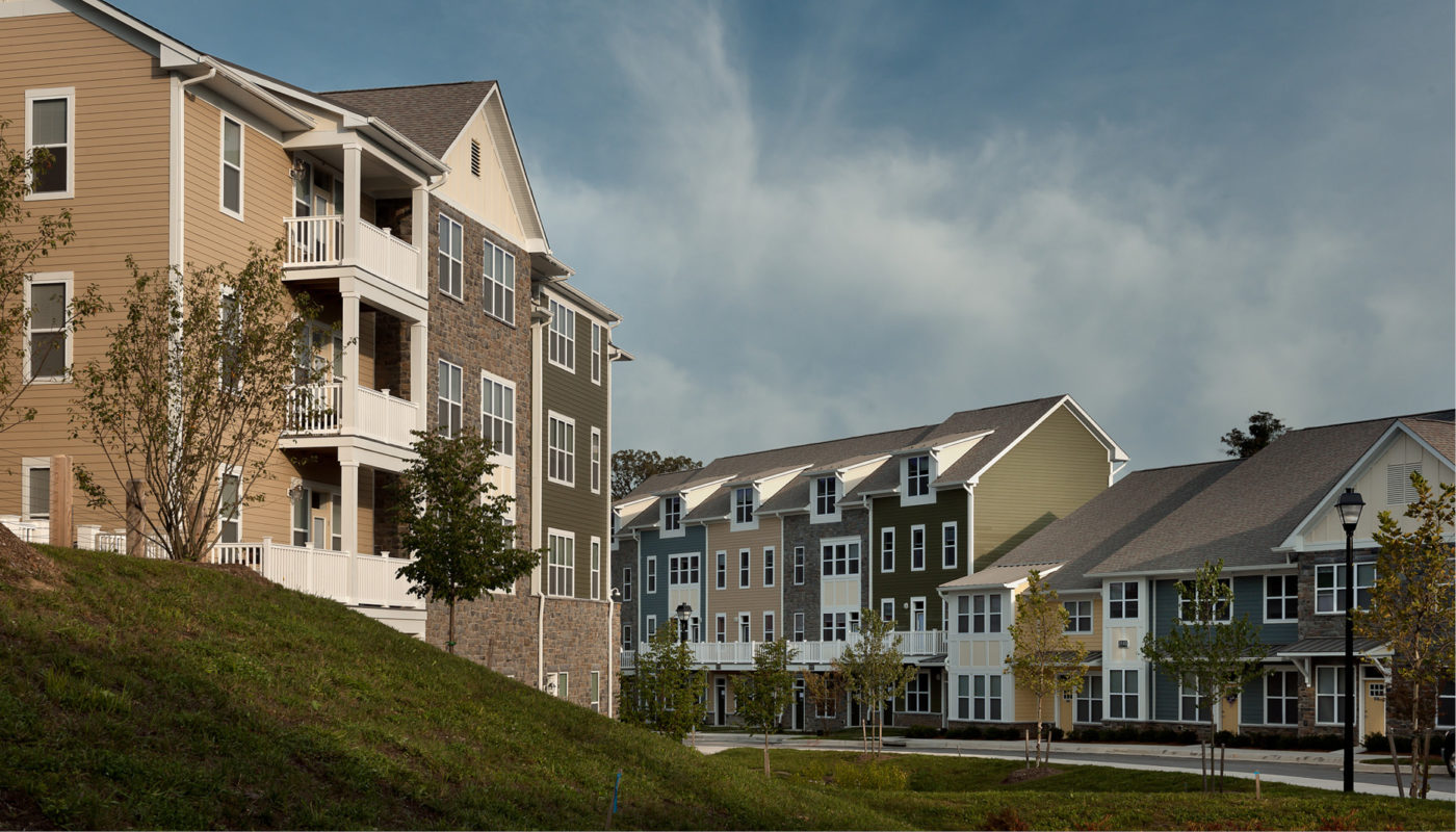 Burgess Mill Station, a row of apartment buildings nestled on a hillside.