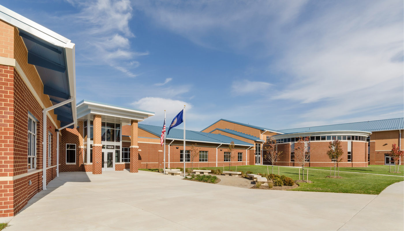 Chris Yung Elementary School, a brick building with a blue sky, located in Prince William County Public Schools.