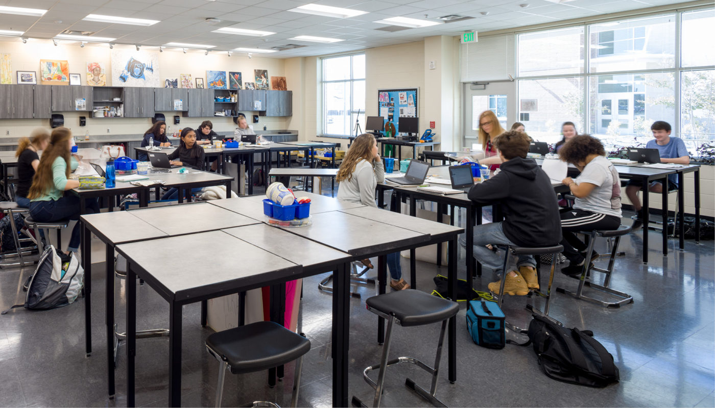 A group of students sitting at desks in an Oak Grove High School classroom.