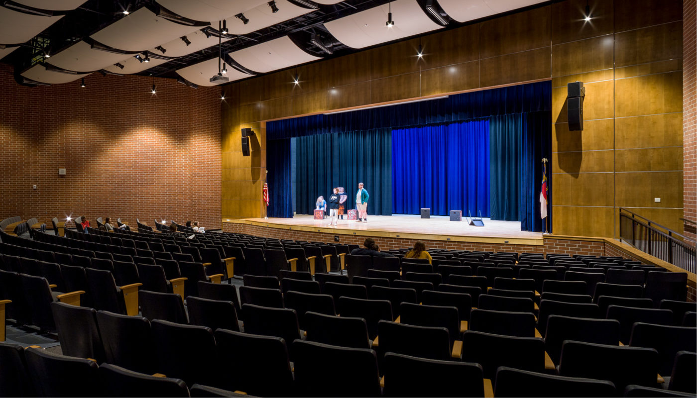 Oak Grove High School's auditorium is a spacious venue that features a well-appointed stage and comfortable seating for audiences.