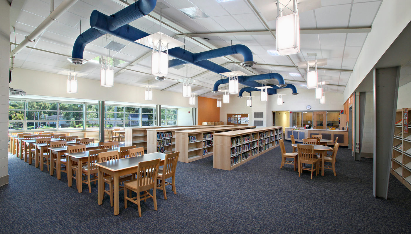 Glenarden Woods Elementary School is a library with a lot of tables and chairs.