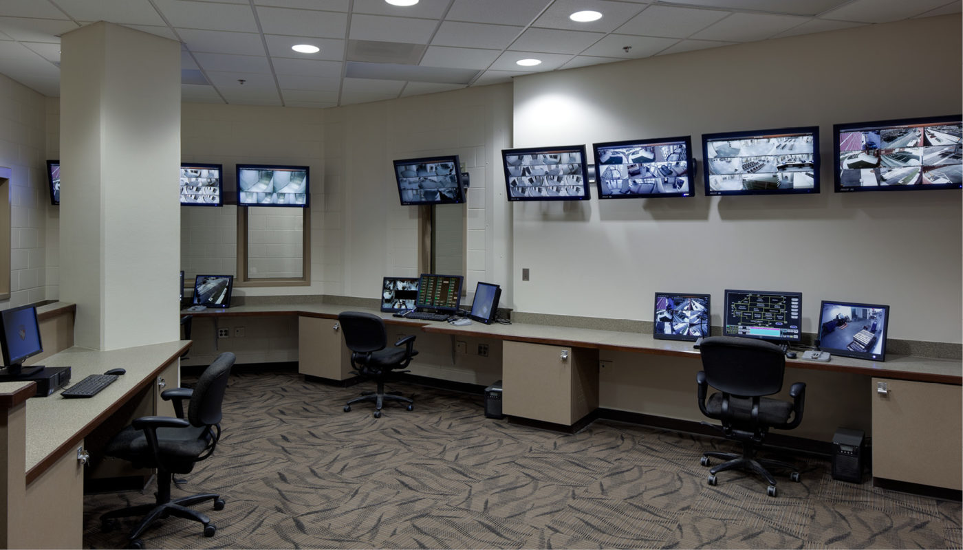 A Detention Center room equipped with numerous computers and monitors in Guilford County.