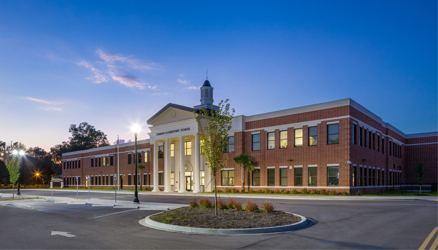 Camden Elementary School, a large brick building at dusk.