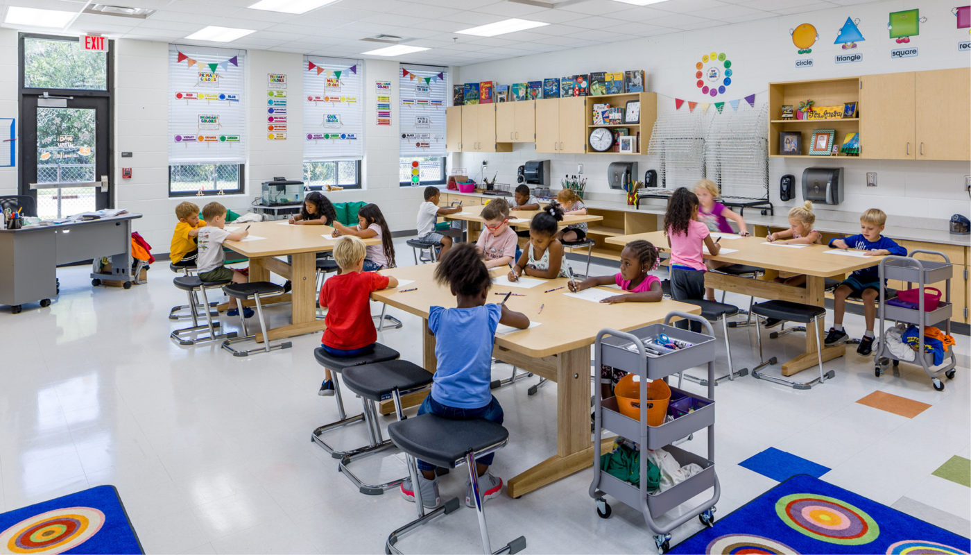 The Kershaw County School District's Camden Elementary School classroom is filled with many children sitting at desks.