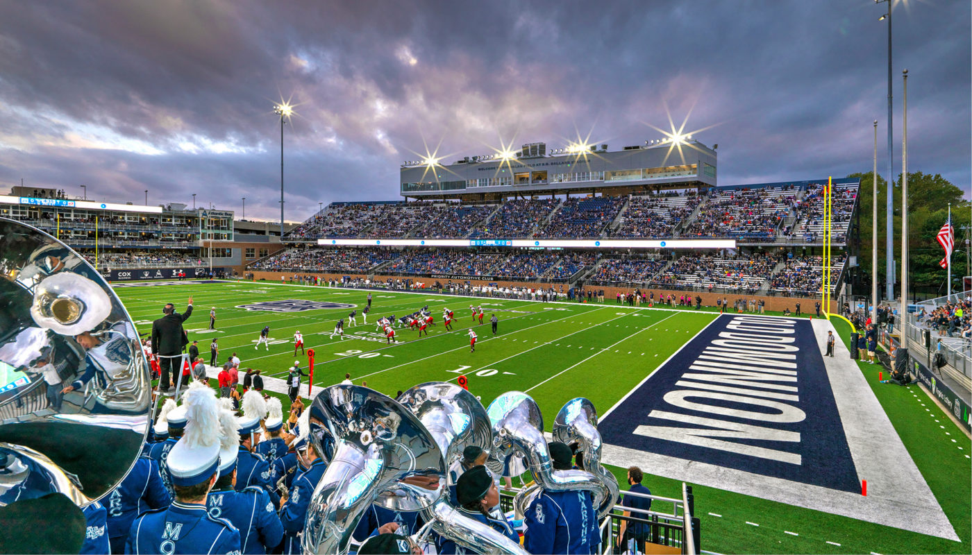 An image of S.B. Ballard Stadium, a football field at Old Dominion University, with a band performing on Kornblau Field.