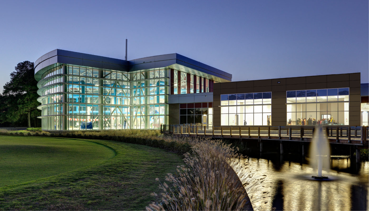 Bow Creek Recreation Center, located in Virginia Beach, features a stunning building complemented by a serene fountain in front.