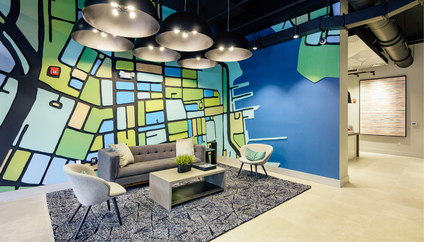 An office with a vibrant mural on the wall, showcasing a wheelhouse of SEO keywords.