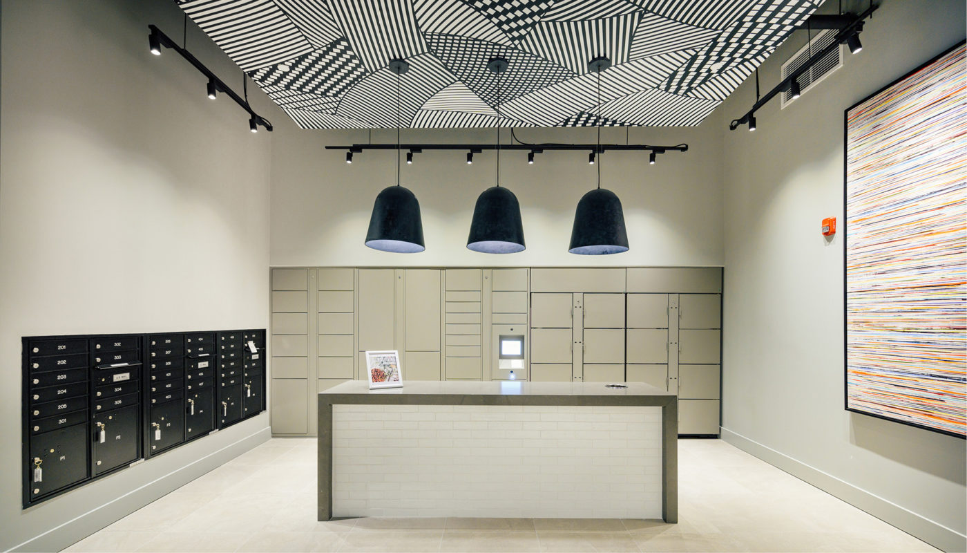 A reception area with a Wheelhouse-shaped black and white pattern on the ceiling.
