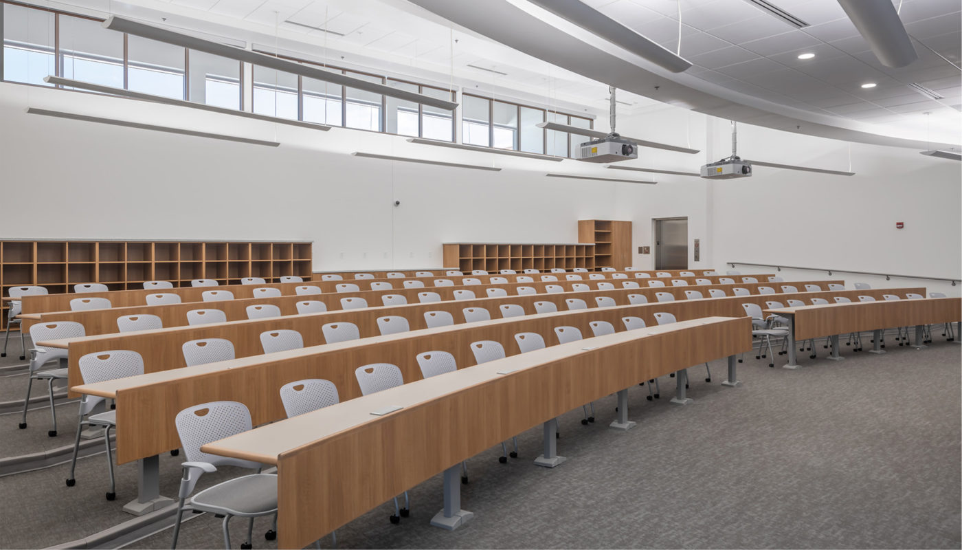 A large lecture hall in Raleigh used as a training center for law enforcement, featuring neatly aligned rows of chairs.