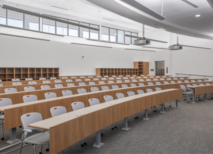 A large lecture hall in Raleigh used as a training center for law enforcement, featuring neatly aligned rows of chairs.