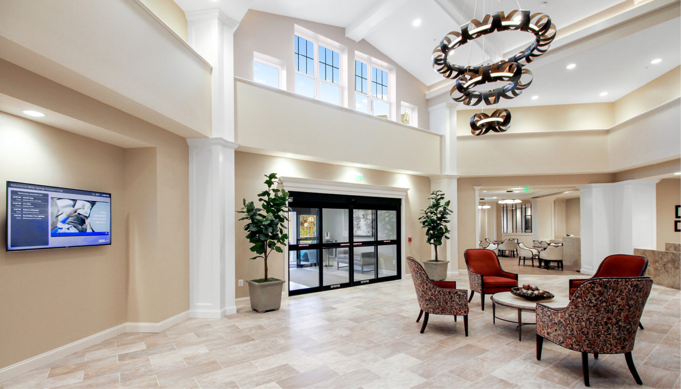 The White Springs lobby features comfortable chairs and a TV for guests to relax and unwind.