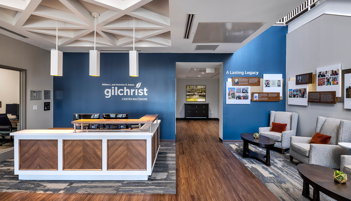 The Gilchrist Center Baltimore offers a modern reception area in an office building.