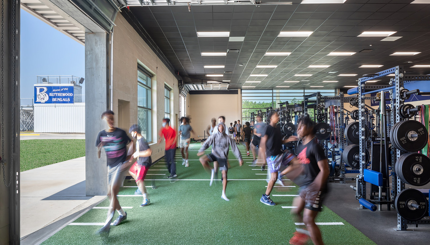 A group of people running in a gym at Blythewood High School in the Richland School District Two.