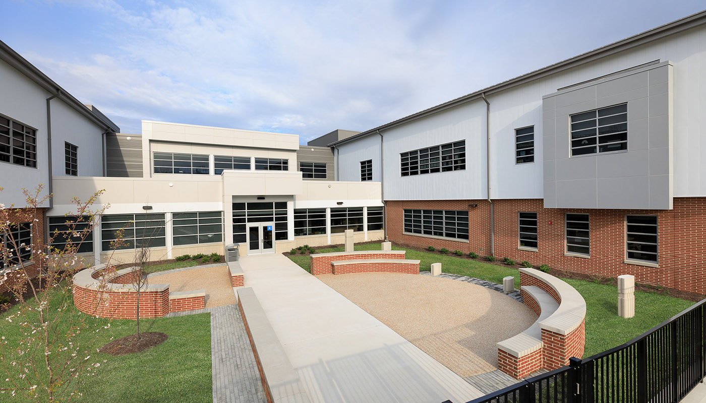 Holladay Elementary School, a brick building with a walkway, is located in Henrico County Public Schools.