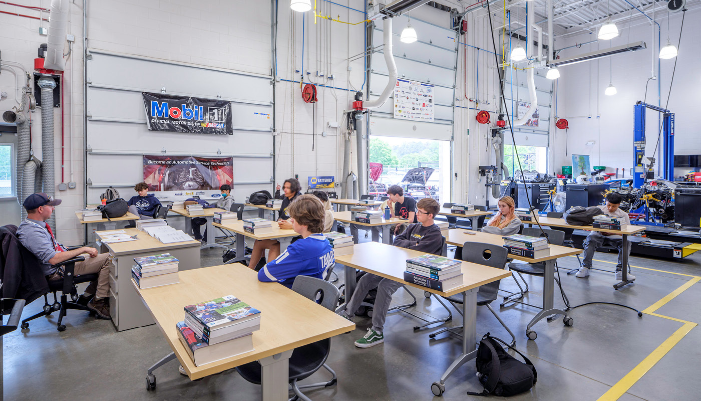 Students at desks in automotive technology classroom in Chapel Hill High School, a renovated K-12 facility in North Carolina